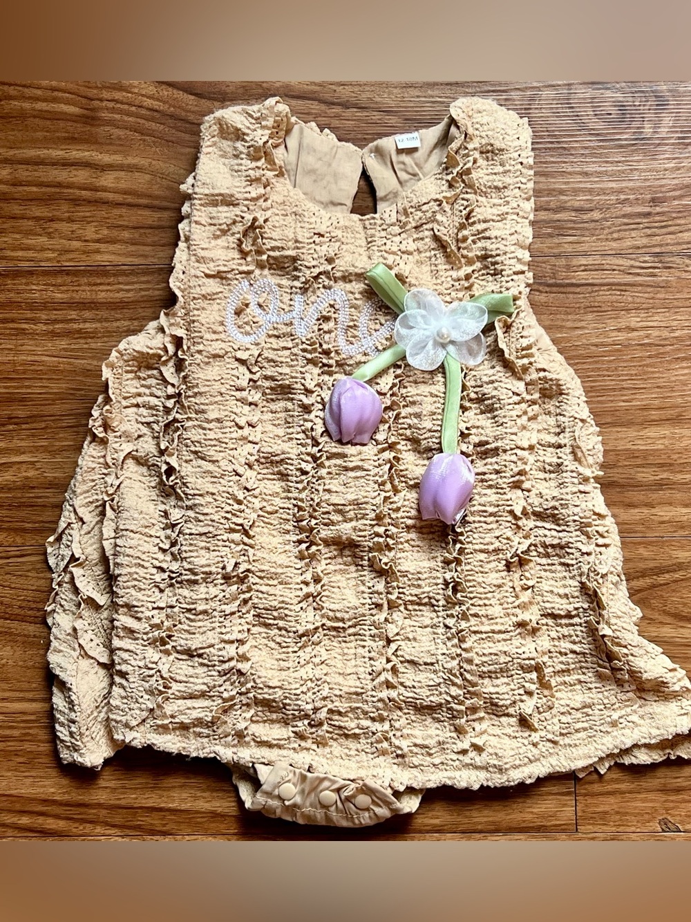 Beige Ruffled Baby One-Piece with Floral Appliqué